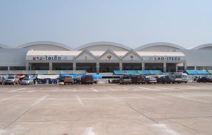 Photograph of Lao ITECC Exhibition Centre in Vientiane, showing the entrance, curved roofs and forecourt